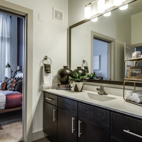 Bathroom with framed mirror and ample counter space brightly lit bathroom with large vanity/sink counter