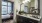 brightly lit bathroom with large vanity/sink counter