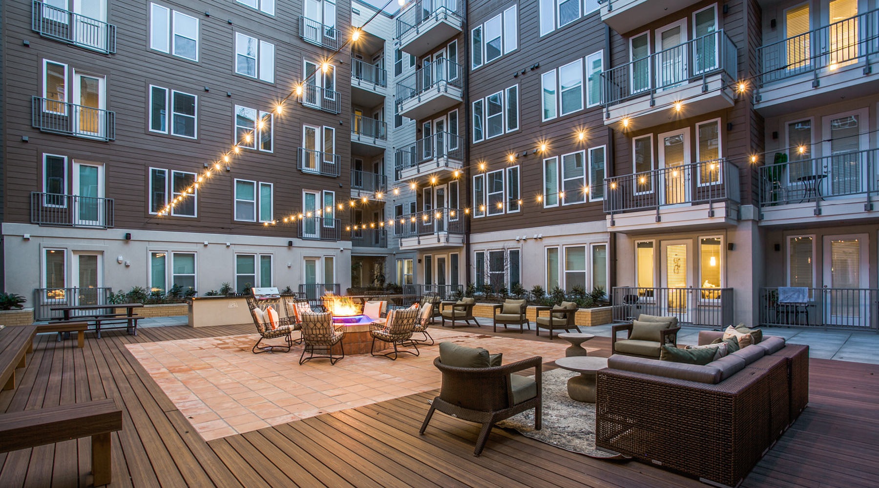 The Art of Living Entertaining area in the courtyard with stringed lighting